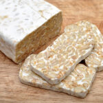 Tempeh is a traditional soy product originally from Indonesia. It is made by a natural culturing and controlled fermentation process that binds soybeans into a cake form.